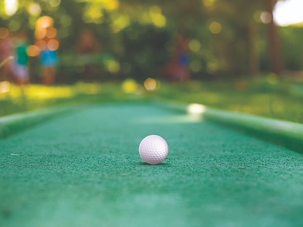 Golf ball on mini golf pitch